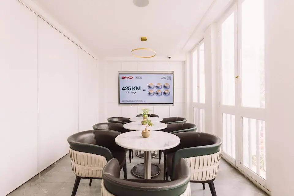 Bright Level 2 VIP room with river-view windows and private seating